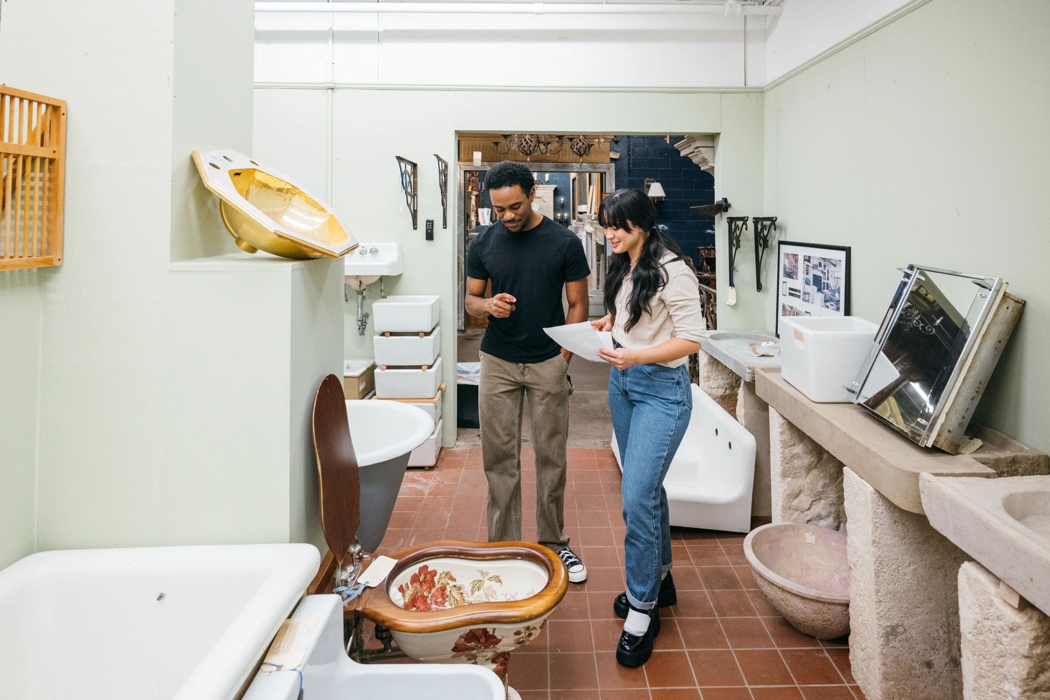 Customers reviewing plumbing fixture options